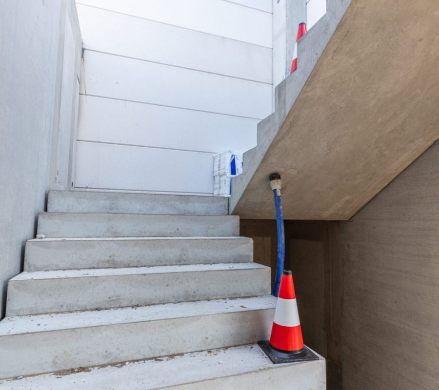 Warehouse stairs construction. Building a new industrial hall or storehouse