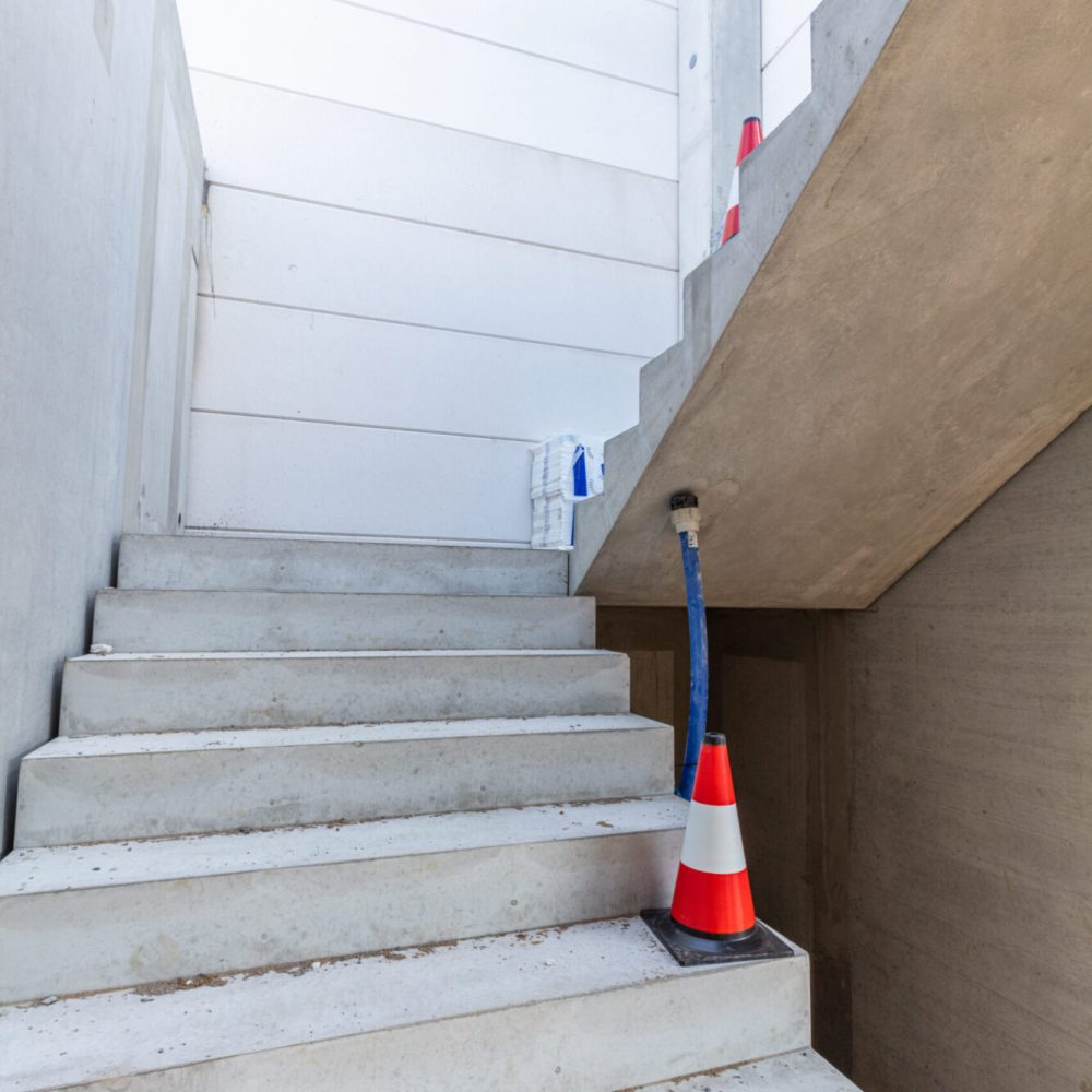 Warehouse stairs construction. Building a new industrial hall or storehouse